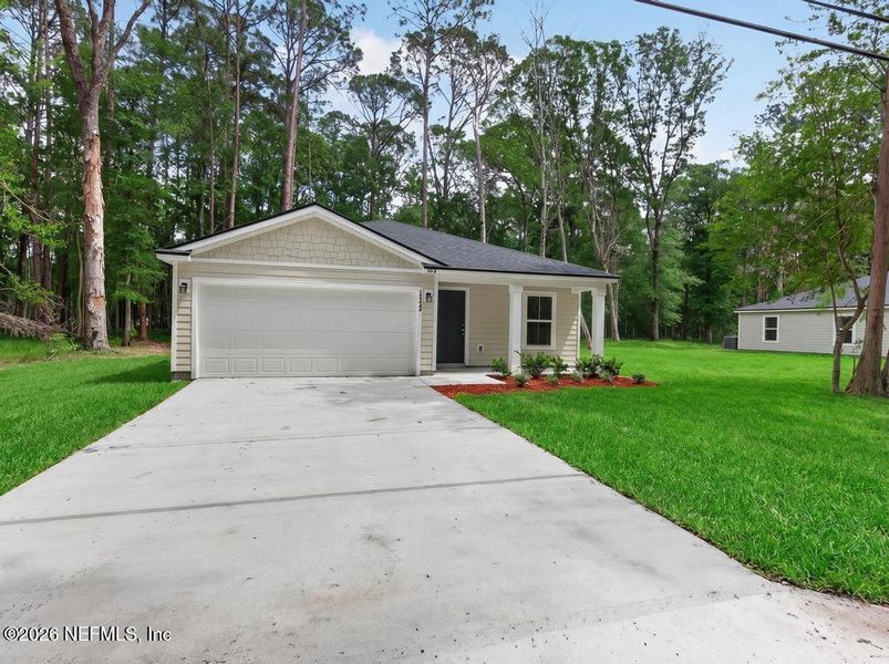 Front exterior of a new home in , Jacksonville, FL, highlighting curb appeal (Image 27).