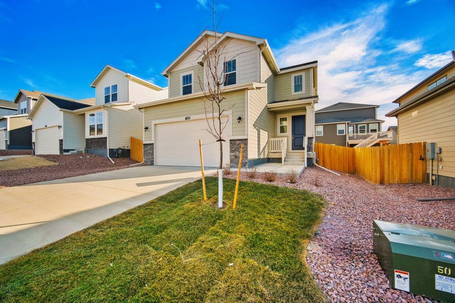 Front exterior of a new home in Ridge at Lorson Ranch, Colorado Springs, CO, highlighting curb appeal (Image 24).