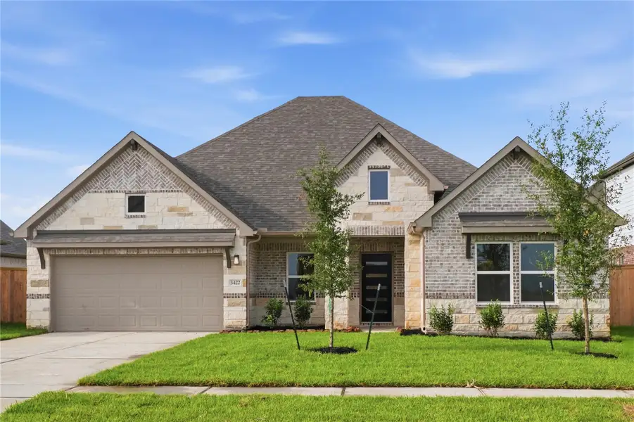 Front exterior of a new home in Foxtail Palms, Manvel, TX, highlighting curb appeal (Image 2). Front exterior of a new home in Foxtail Palms, Manvel, TX, highlighting curb appeal (Image 2).