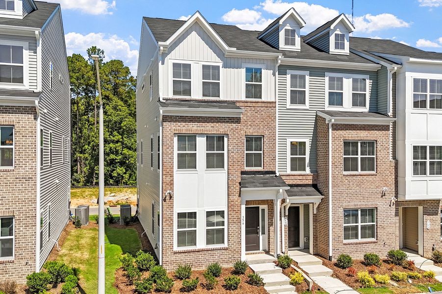 Front exterior of a new home in Renaissance at White Oak, Garner, NC, highlighting curb appeal (Image 2). Front exterior of a new home in Renaissance at White Oak, Garner, NC, highlighting curb appeal (Image 2).
