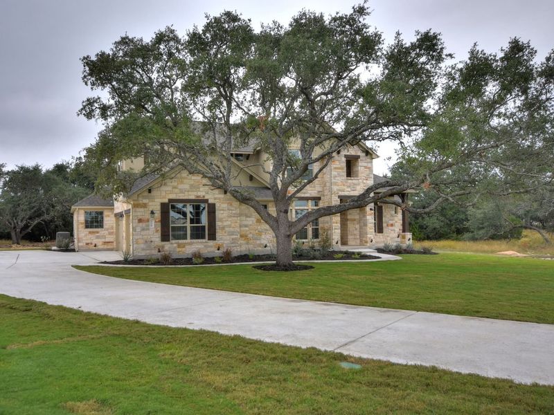 Representative exterior photo of a completed home built from the Madera II by Giddens Homes in Scofield Farms Estates, Georgetown, TX (Image 54).