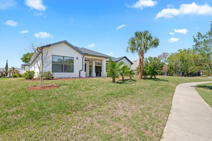 Front exterior of a new home in , Palm Coast, FL, highlighting curb appeal (Image 26). Front exterior of a new home in , Palm Coast, FL, highlighting curb appeal (Image 26).