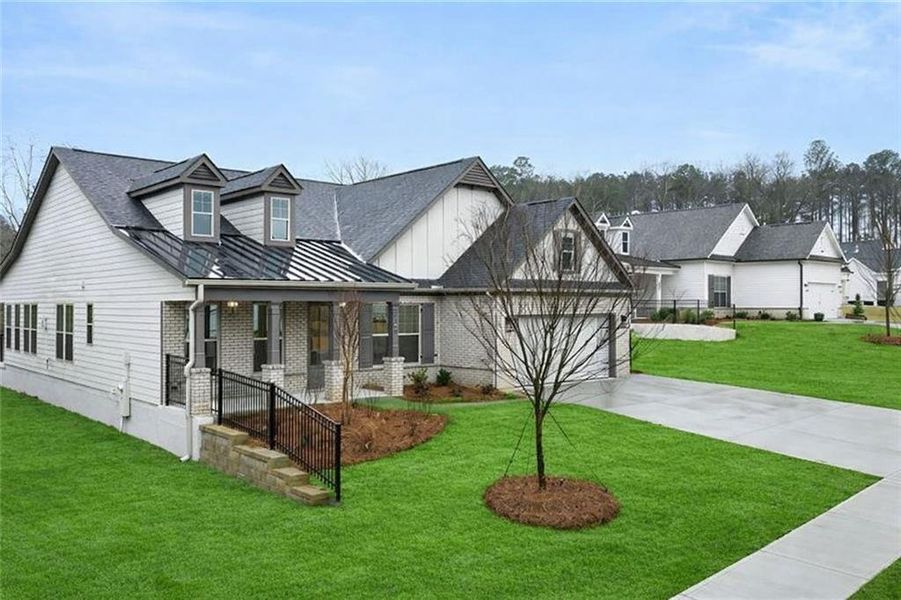 Front exterior of a new home in Soleil Belmont Park, Canton, GA, highlighting curb appeal (Image 25).