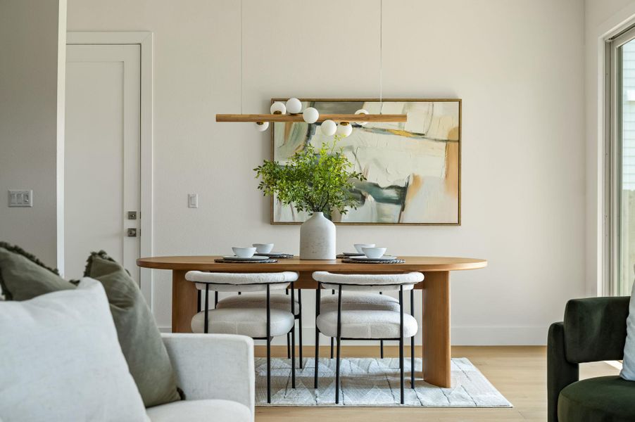 A well-lit dining area offers a seamless flow for entertaining and daily living. A well-lit dining area offers a seamless flow for entertaining and daily living.