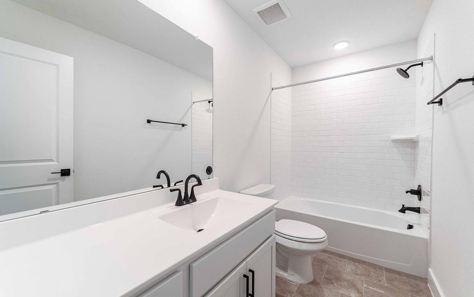 Bathroom with vanity and shower / bath combination