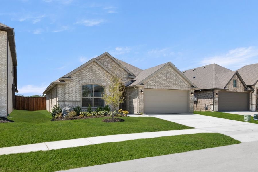 Front exterior of a new home in Meadow Park at The Meadows, Ponder, TX, highlighting curb appeal (Image 2). Front exterior of a new home in Meadow Park at The Meadows, Ponder, TX, highlighting curb appeal (Image 2).