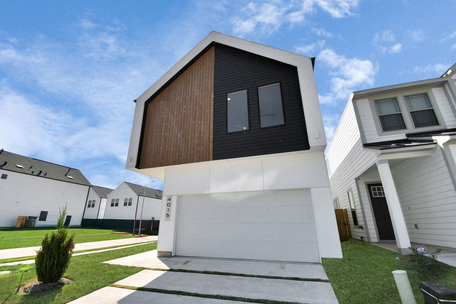 Front exterior of a new home in Antigua, Houston, TX, highlighting curb appeal (Image 26).