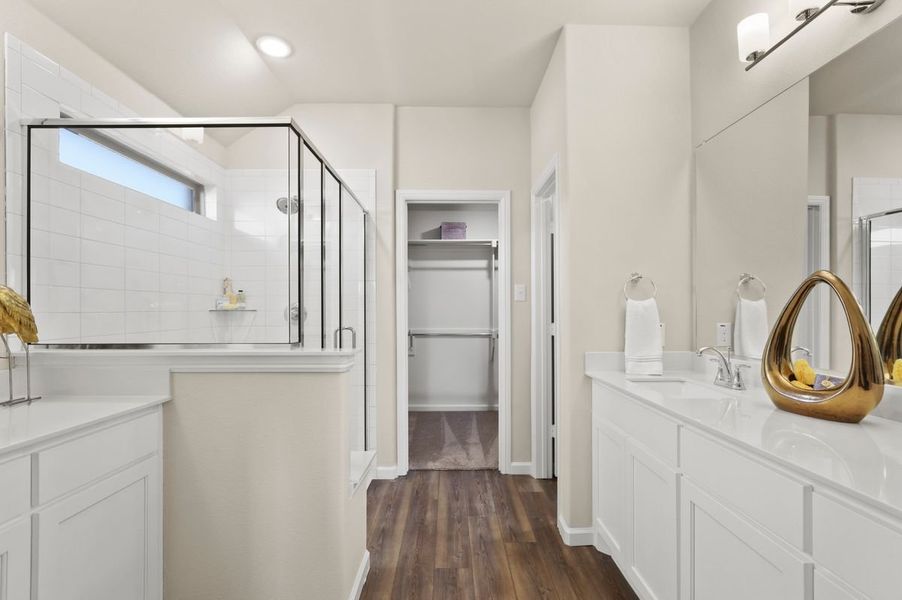 Primary Bathroom in the Heisman home plan by Trophy Signature Homes – REPRESENTATIVE PHOTO