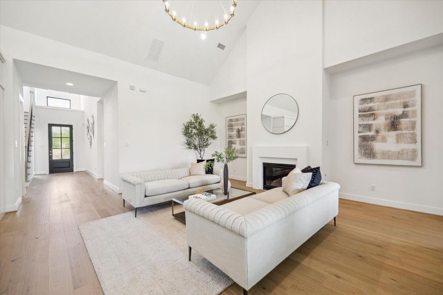 Welcome home! The Living Area has high, sloped ceiling with on-trend light fixtures, and gas log fireplace. Welcome home! The Living Area has high, sloped ceiling with on-trend light fixtures, and gas log fireplace.