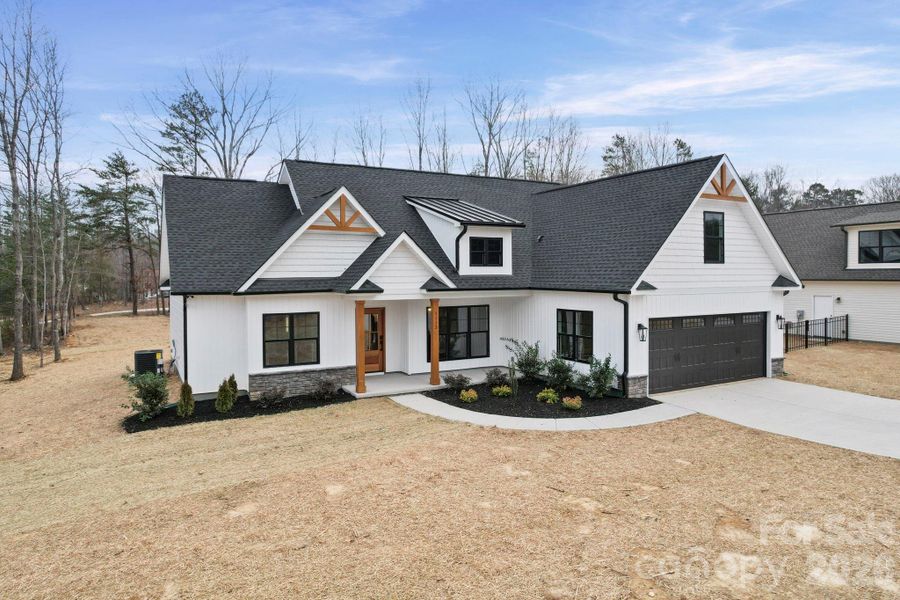 Front exterior of a new home in , Oakboro, NC, highlighting curb appeal (Image 15).