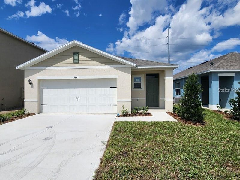 Front exterior of a new home in , Kissimmee, FL, highlighting curb appeal (Image 1). Front exterior of a new home in , Kissimmee, FL, highlighting curb appeal (Image 1).