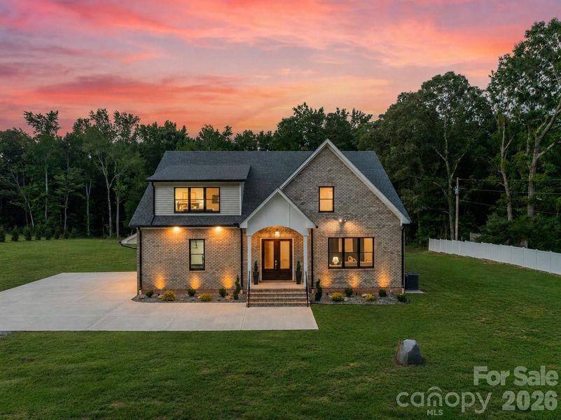 Front exterior of a new home in , Wesley Chapel, NC, highlighting curb appeal (Image 25). Front exterior of a new home in , Wesley Chapel, NC, highlighting curb appeal (Image 25).