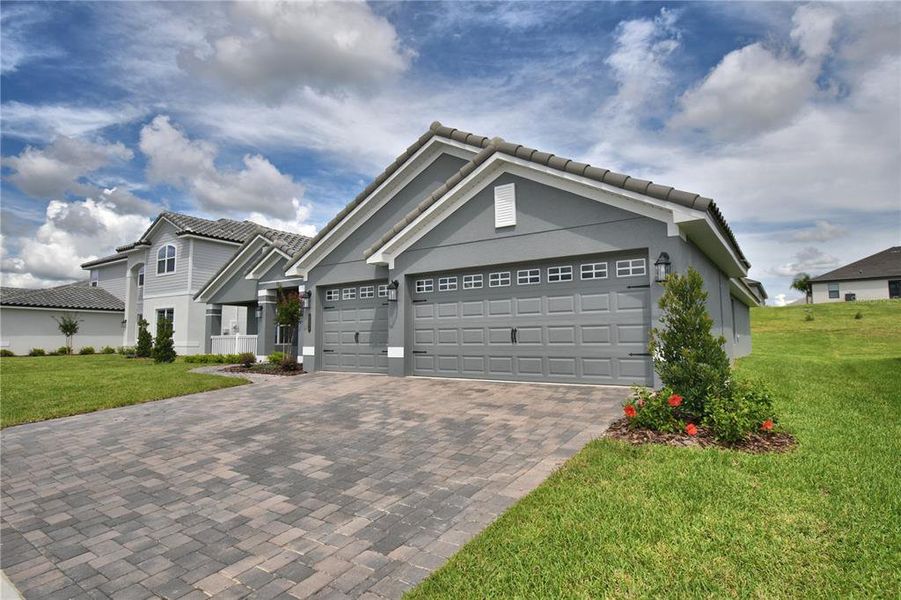 Front exterior of a new home in , Auburndale, FL, highlighting curb appeal (Image 2). Front exterior of a new home in , Auburndale, FL, highlighting curb appeal (Image 2).