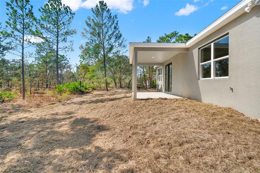 Exterior details and patio area of a home in , Citrus Springs (Image 29).