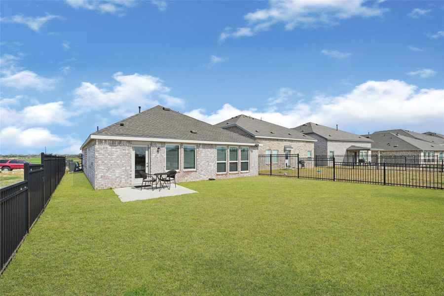Exterior details and patio area of a home in Sunterra, Katy (Image 3). Exterior details and patio area of a home in Sunterra, Katy (Image 3).