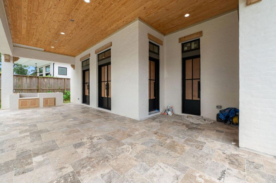 Covered Patio offers speaker pre-wire & outdoor kitchen w/ Coyote grill.