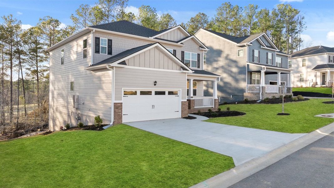Front exterior of a new home in Southwind Village, Evans, GA, highlighting curb appeal (Image 23).