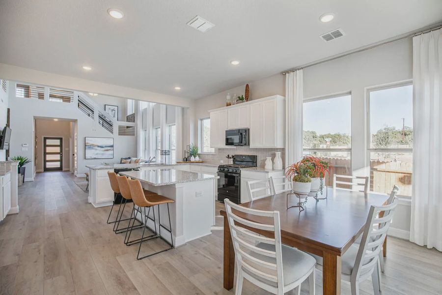 Representative furnished interior of a home built from the Lincoln by Chesmar Homes in Buffalo Crossing, Cibolo (Image 6).