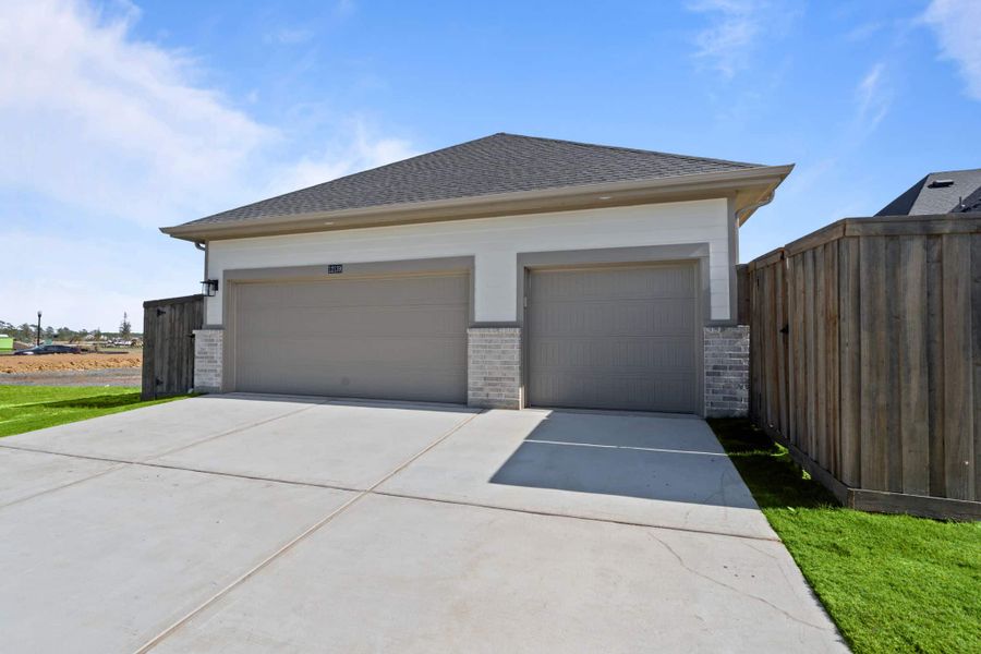 Front exterior of a new home in Riceland, Mont Belvieu, TX, highlighting curb appeal (Image 21). Front exterior of a new home in Riceland, Mont Belvieu, TX, highlighting curb appeal (Image 21).