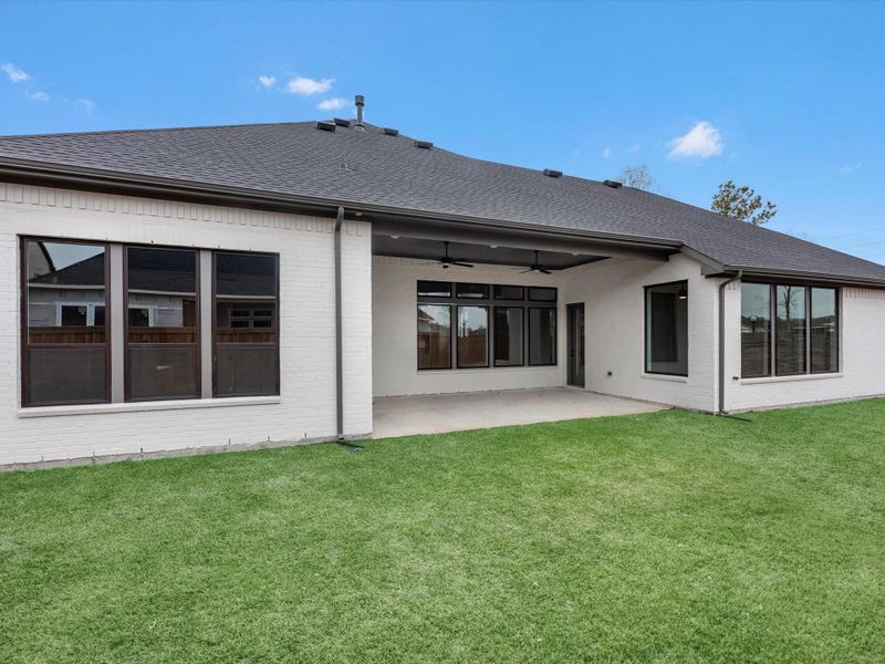 Exterior details and patio area of a home in Woodson’s Reserve, Spring (Image 3).
