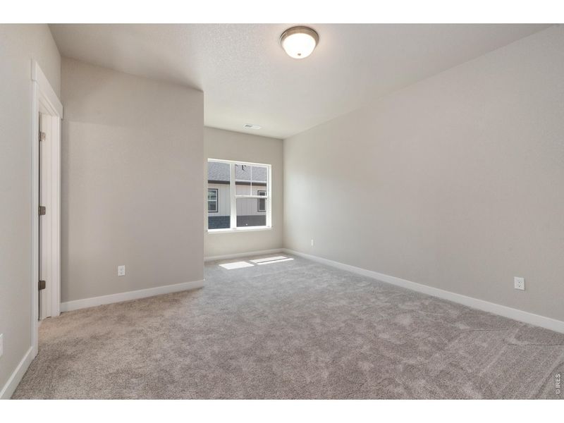 Spacious, unfurnished interior of a new home in The Lakes at Centerra - Discovery, Loveland (Image 9).