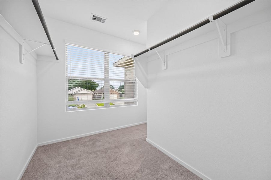 Lots of space in the master closet. Lots of space in the master closet.