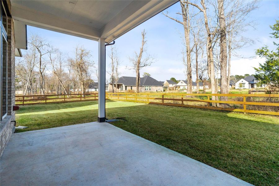 Step outside to the covered rear patio, the perfect extension of your indoor living space for year-round enjoyment. Note that there is a gas stub out for ease of outdoor cooking. Step outside to the covered rear patio, the perfect extension of your indoor living space for year-round enjoyment. Note that there is a gas stub out for ease of outdoor cooking.