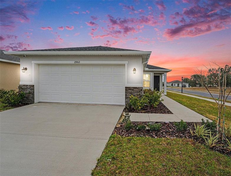 Front exterior of a new home in , Haines City, FL, highlighting curb appeal (Image 23). Front exterior of a new home in , Haines City, FL, highlighting curb appeal (Image 23).