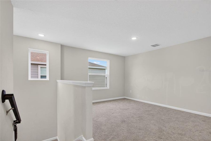 Spacious, unfurnished interior of a new home in Seasons at Forest Creek, Haines City (Image 24).