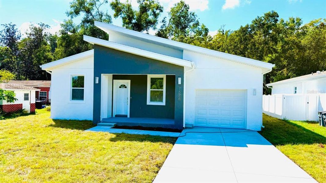 Front exterior of a new home in , New Port Richey, FL, highlighting curb appeal (Image 1).