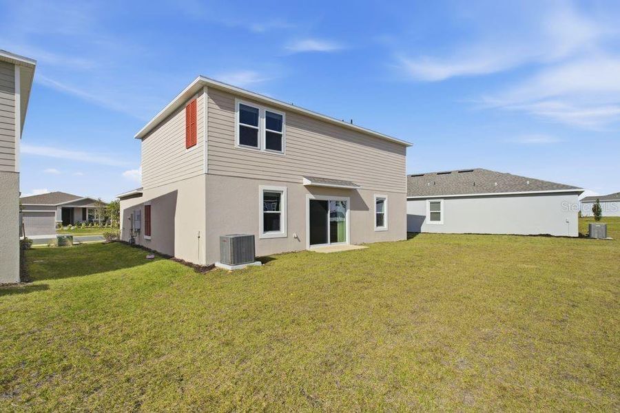 Exterior details and patio area of a home in Waterstone, Groveland (Image 26).