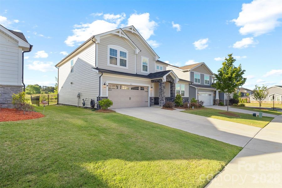 Front exterior of a new home in Waxhaw Landing, Monroe, NC, highlighting curb appeal (Image 2). Front exterior of a new home in Waxhaw Landing, Monroe, NC, highlighting curb appeal (Image 2).