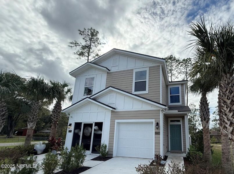 Front exterior of a new home in Hansen Creek, Jacksonville, FL, highlighting curb appeal (Image 1).