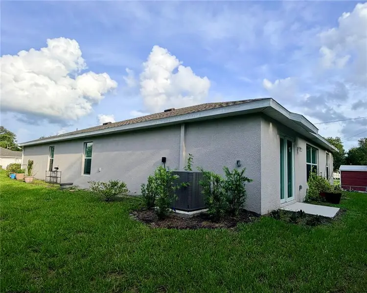 Exterior details and patio area of a home in , Port Charlotte (Image 2). Exterior details and patio area of a home in , Port Charlotte (Image 2).
