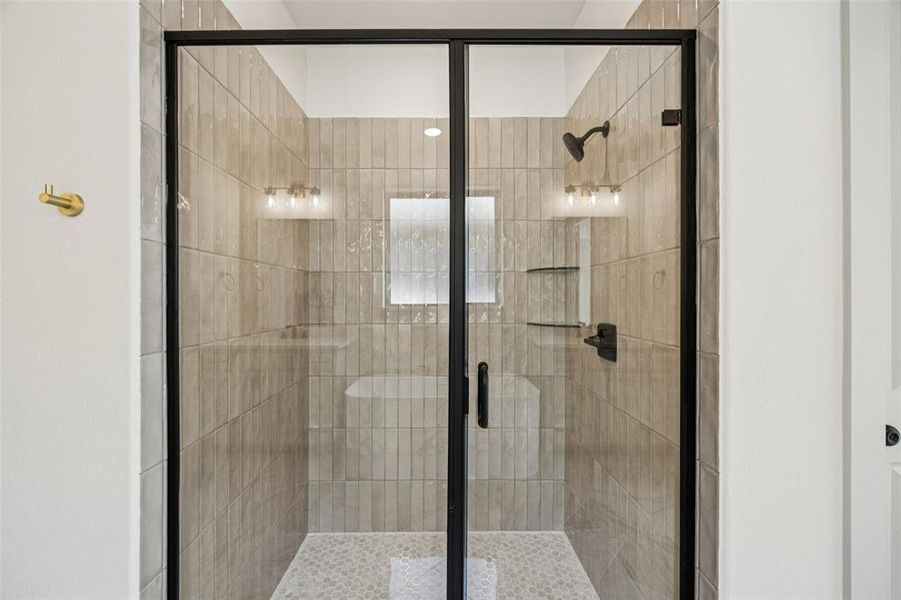 You'll love staring or ending your day in this spacious walk in shower in your new owner's bath.