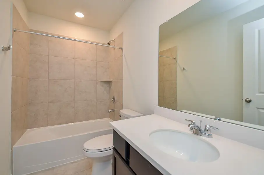 Furnished interior view inside a new home in Sunterra, Katy (Image 6).