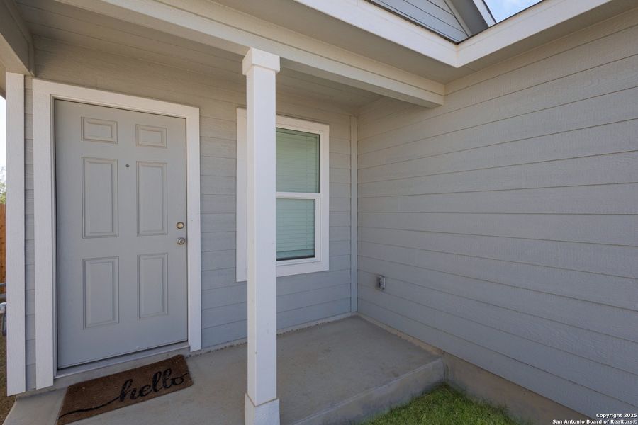 Exterior details and patio area of a home in Ruby Crossing: Cottage Collection, San Antonio (Image 14).