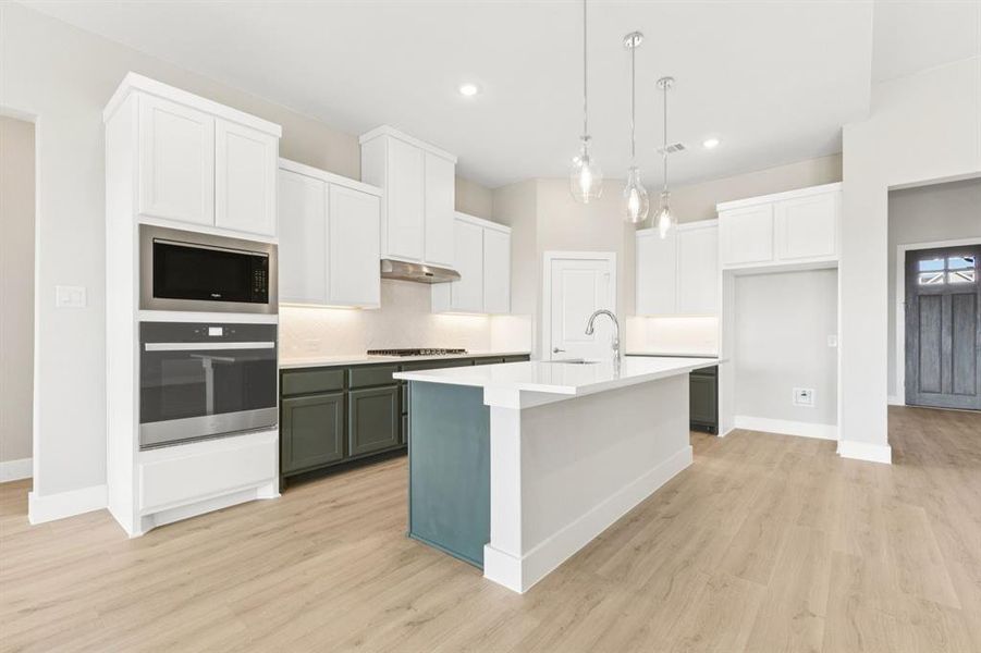 Bathroom featuring double vanity, light tile patterned floors, and shower / tub combination Bathroom featuring double vanity, light tile patterned floors, and shower / tub combination