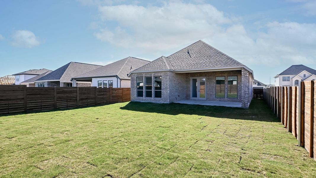 Exterior details and patio area of a home in Juniper Springs, Lockhart (Image 3).