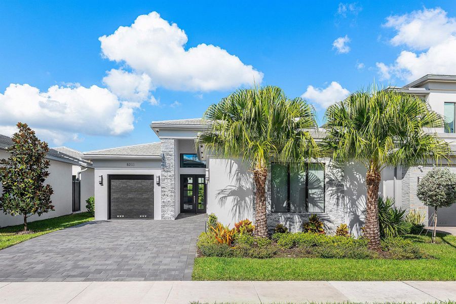 Front exterior of a new home in , Boca Raton, FL, highlighting curb appeal (Image 24). Front exterior of a new home in , Boca Raton, FL, highlighting curb appeal (Image 24).