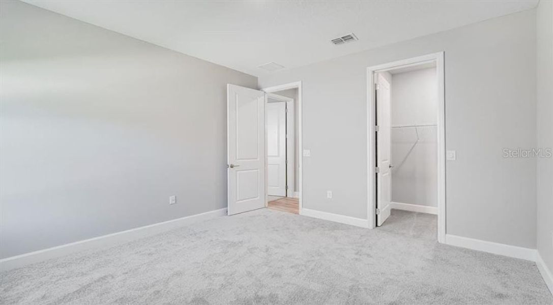 Spacious, unfurnished interior of a new home in The Cove at West Port, Port Charlotte (Image 12).