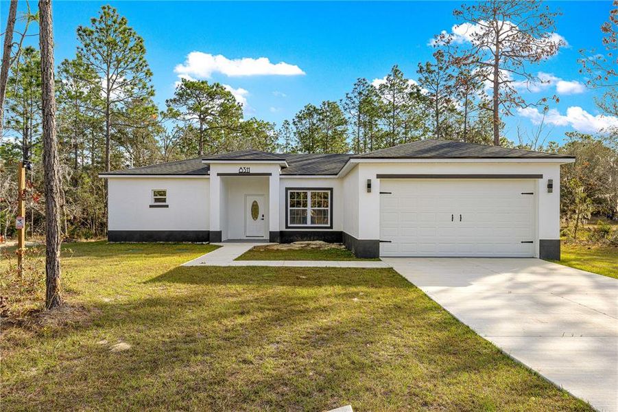 Front exterior of a new home in , Dunnellon, FL, highlighting curb appeal (Image 26). Front exterior of a new home in , Dunnellon, FL, highlighting curb appeal (Image 26).
