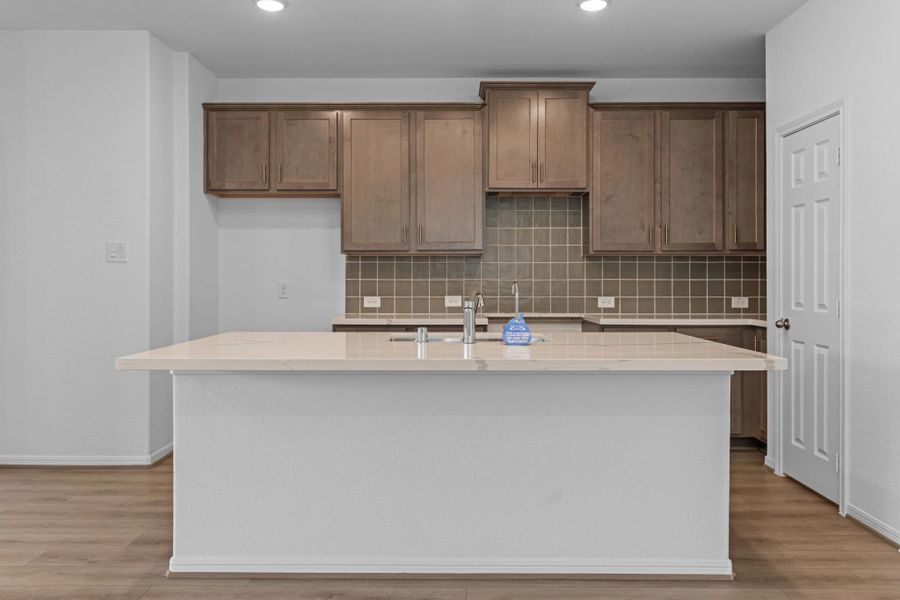 Kitchen. Note: Sample product photo. Actual exterior and interior selections may vary by homesite. Photo may be virtually staged