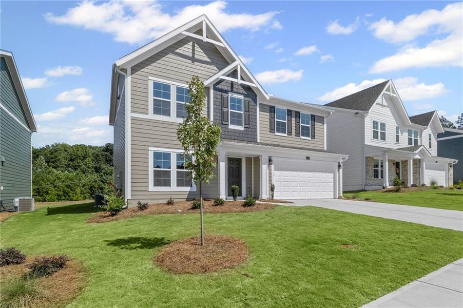 Front exterior of a new home in Sage Woods, Dallas, GA, highlighting curb appeal (Image 17). Front exterior of a new home in Sage Woods, Dallas, GA, highlighting curb appeal (Image 17).