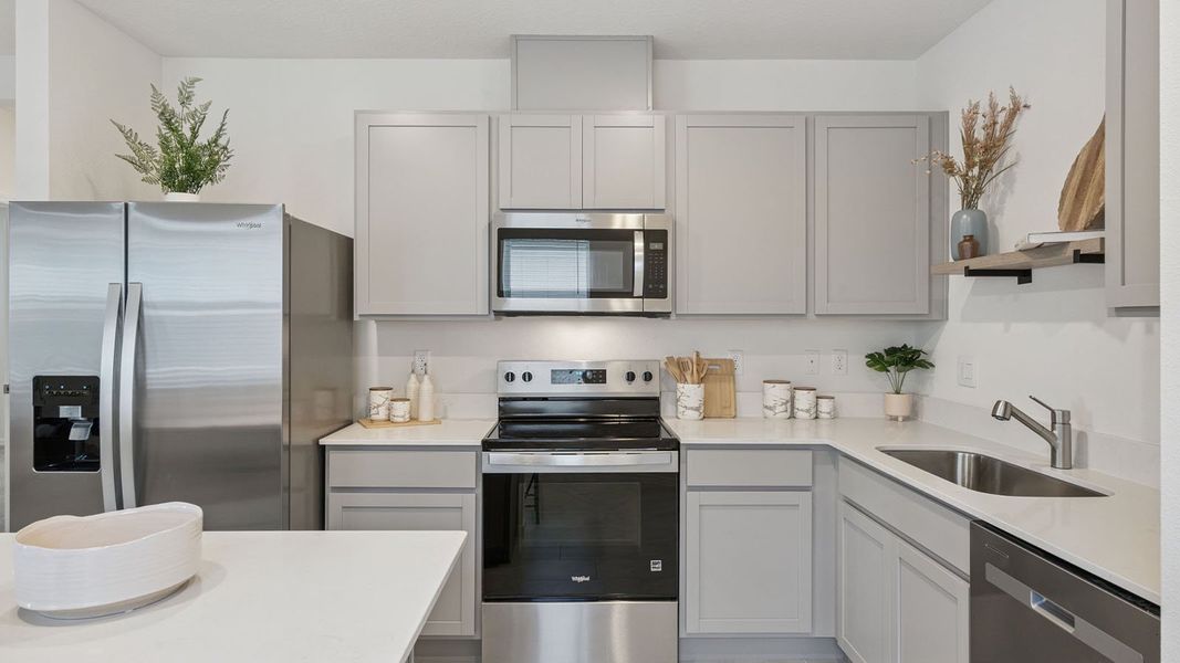 Representative furnished interior of a home built from the Downing II by D.R. Horton in Villamar, Winter Haven (Image 5).