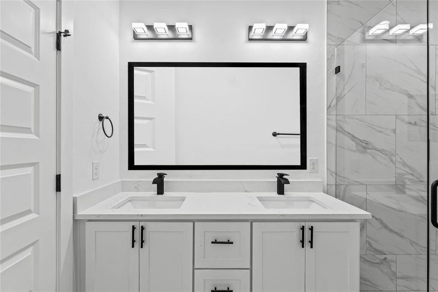 Bathroom with vanity and an enclosed shower