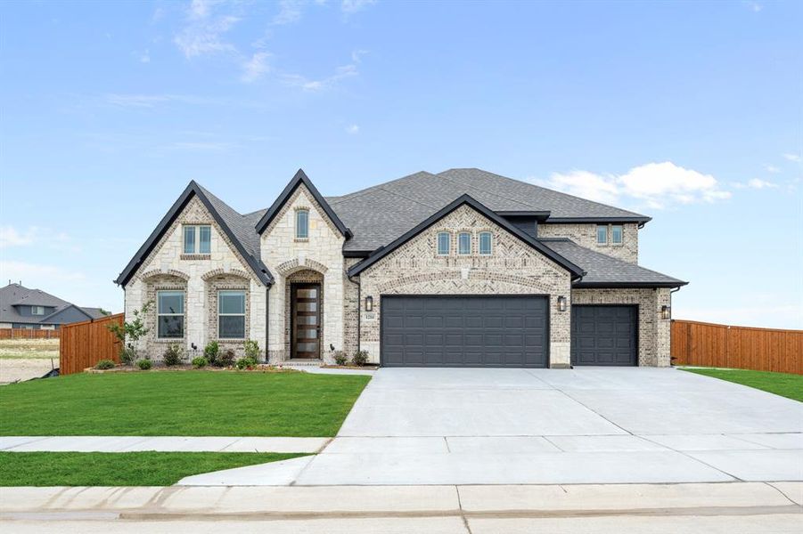 Front exterior of a new home in Timberbrook, Justin, TX, highlighting curb appeal (Image 1). Front exterior of a new home in Timberbrook, Justin, TX, highlighting curb appeal (Image 1).