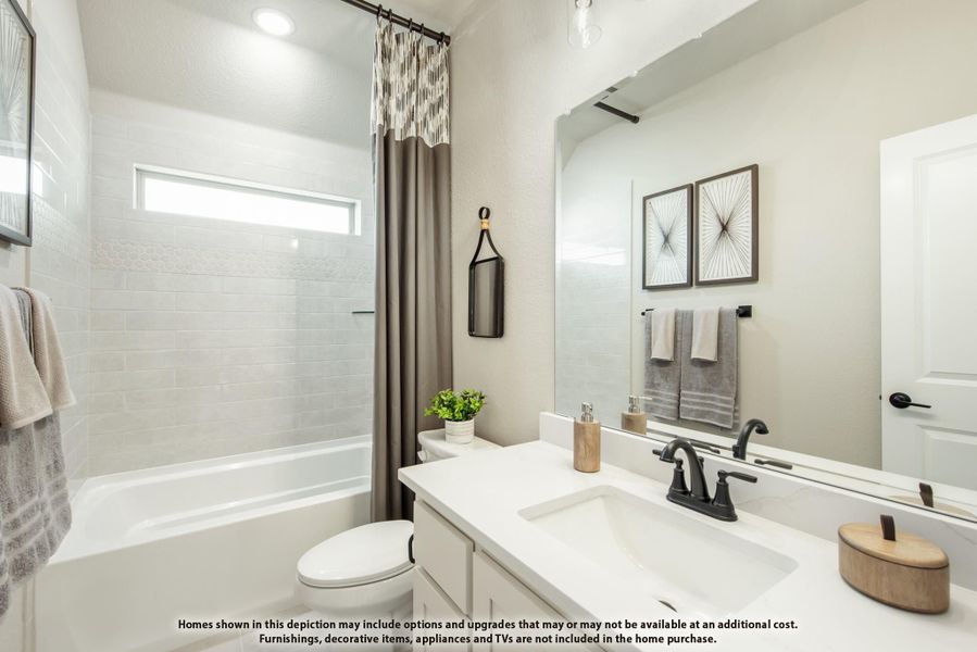 Bathroom with white vanity, tub-shower combo with tile surround, and large mirror Bathroom with white vanity, tub-shower combo with tile surround, and large mirror