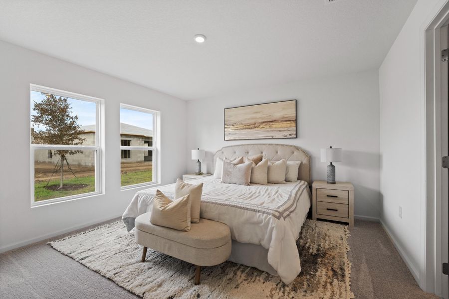 A bedroom with a bed and a couch. A bedroom with a bed and a couch.