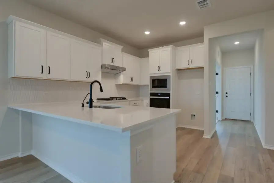 Representative furnished interior of a home built from the Brodie by Ashton Woods in Saddlebrook Ranch, Schertz (Image 5).